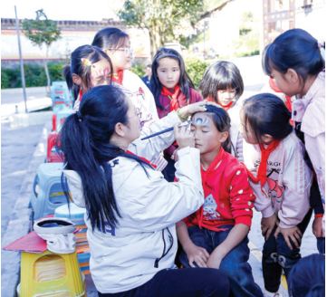 A volunteer with students in rural China