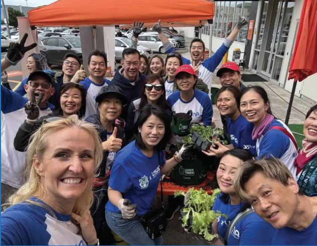 Volunteers celebrate a Garden Tower build