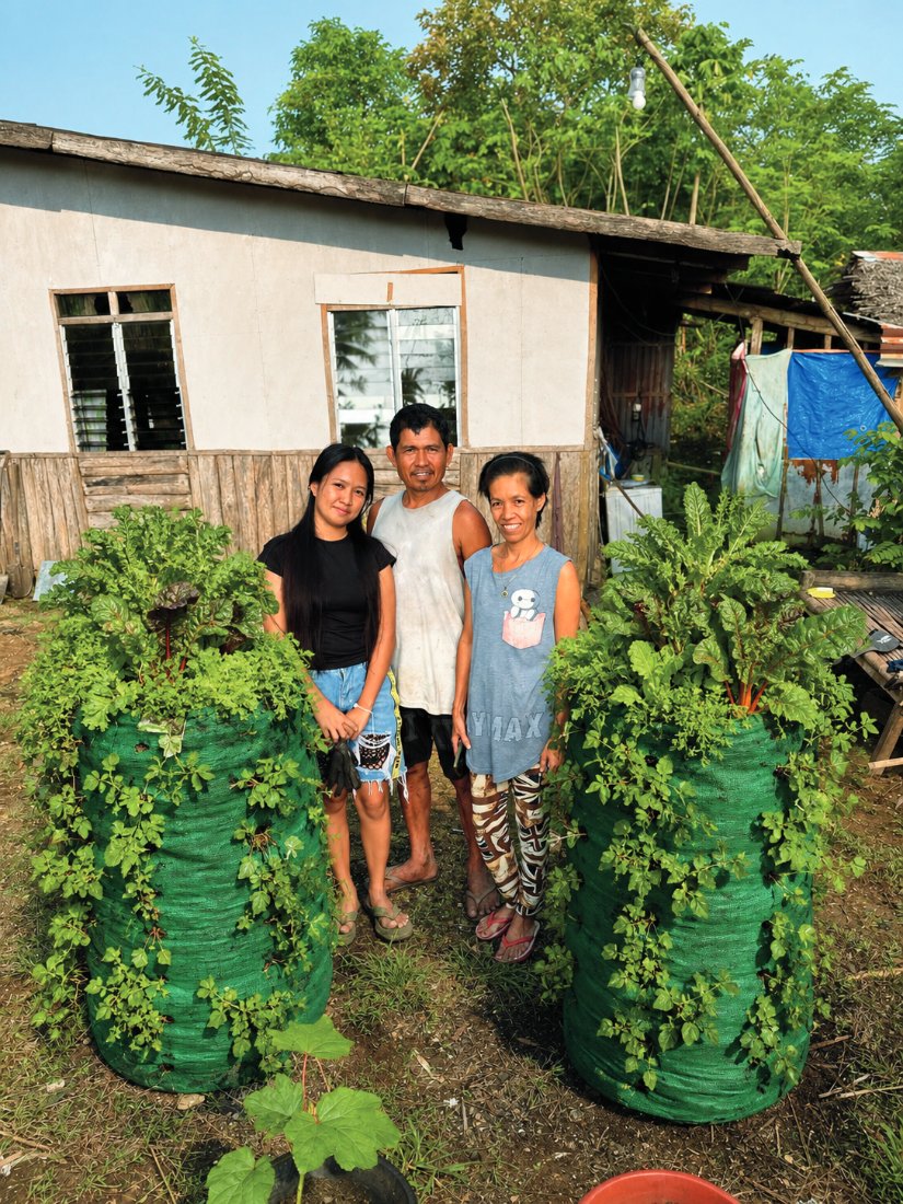 Jessa Panergar and her family between two thriving Garden Towers in the Philippines